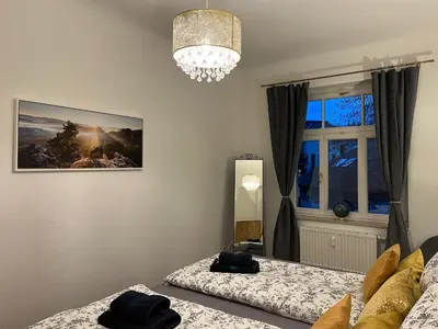 Ein Bett oder Betten in einem Zimmer der Unterkunft Wohnperle: zentrumsnah*ruhig*Familienbett*2 SZ
