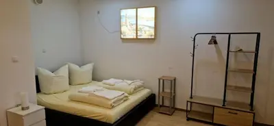 Ein Bett oder Betten in einem Zimmer der Unterkunft Schlossstrasse