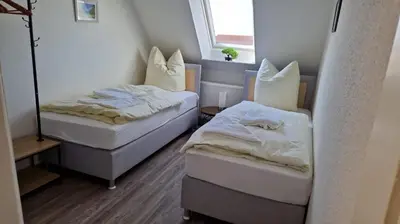 Ein Bett oder Betten in einem Zimmer der Unterkunft Schillerstrasse
