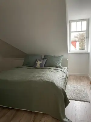 Ein Bett oder Betten in einem Zimmer der Unterkunft Apartment ELBHIRSCH im beliebten Villenviertel Weißer Hirsch
