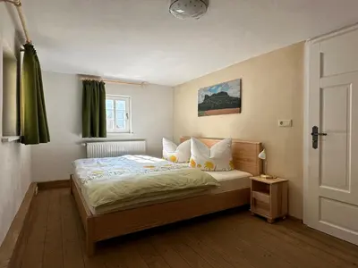 Ein Bett oder Betten in einem Zimmer der Unterkunft Gründelstube