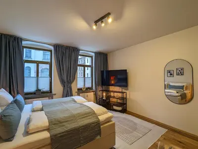 Ein Bett oder Betten in einem Zimmer der Unterkunft Royal Apart Chemnitz 1 - Terrasse nahe Zeisigwald