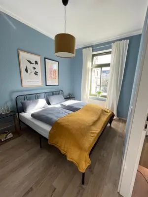Ein Bett oder Betten in einem Zimmer der Unterkunft K2-Project - Blaues Wunder - Smarthome am Kaßberg