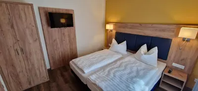 Ein Bett oder Betten in einem Zimmer der Unterkunft Ferienwohnungen SATKULA