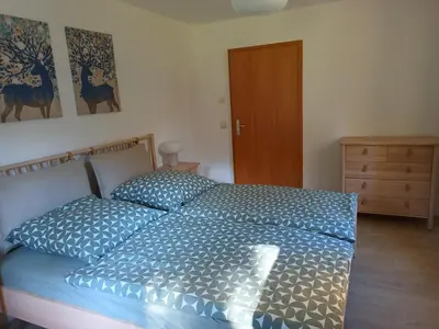 Ein Bett oder Betten in einem Zimmer der Unterkunft Ferienwohnung Wandersfreud