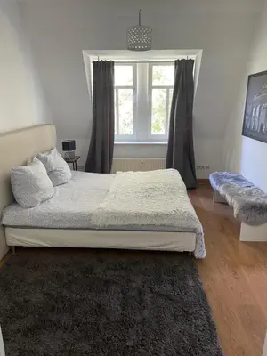 Ein Bett oder Betten in einem Zimmer der Unterkunft Dresden City
