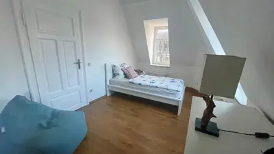 Ein Bett oder Betten in einem Zimmer der Unterkunft Dresden City