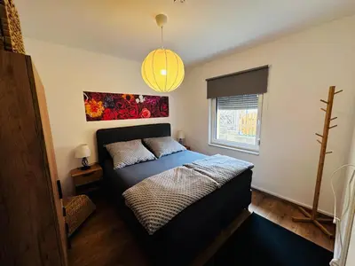 Ein Bett oder Betten in einem Zimmer der Unterkunft Fischis Ferienwohnung Struppen
