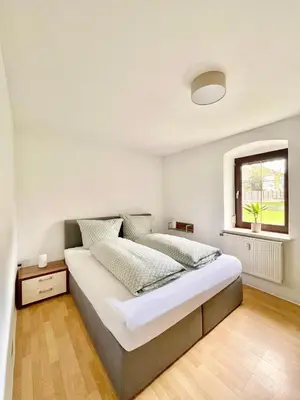 Ein Bett oder Betten in einem Zimmer der Unterkunft Ferienwohnung am Rathaus