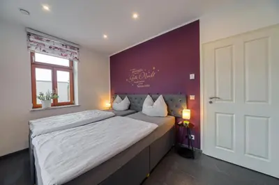 Ein Bett oder Betten in einem Zimmer der Unterkunft Villa-Harmonie Dresden