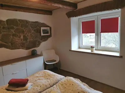 Ein Bett oder Betten in einem Zimmer der Unterkunft Ferienhaus Emilia