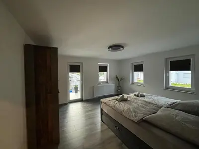 Ein Bett oder Betten in einem Zimmer der Unterkunft Ferienwohnung Papststeinblick
