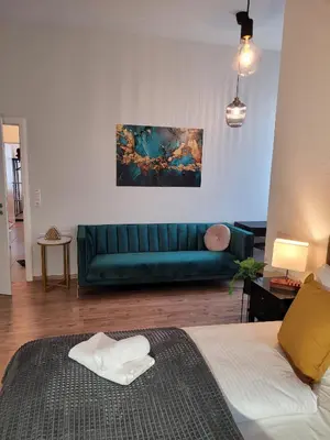 Ein Bett oder Betten in einem Zimmer der Unterkunft T21 - Apartment direkt im Zentrum mit Parkplatz