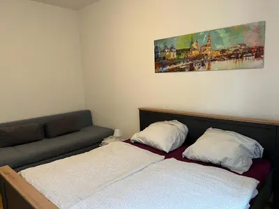 Ein Bett oder Betten in einem Zimmer der Unterkunft Ferienwohnung für kleine und große Reisegruppe
