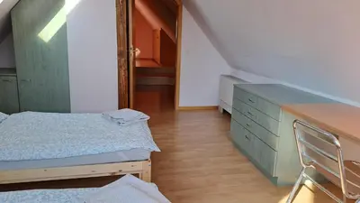 Ein Bett oder Betten in einem Zimmer der Unterkunft Ferienwohnung Zum alten Kutscher