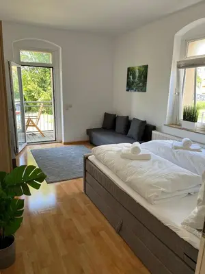 Ein Bett oder Betten in einem Zimmer der Unterkunft Apartment Leuben - Stylisch - Balkon - Küche