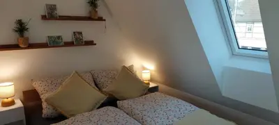 Ein Bett oder Betten in einem Zimmer der Unterkunft Ferienwohnungen Urlaubsglück