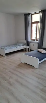 Ein Bett oder Betten in einem Zimmer der Unterkunft Moderne Monteurswohnung in Chemnitz