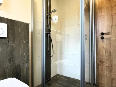 Ein Badezimmer in der Unterkunft Ferienhäuser KRABAT-Mühle Schwarzkollm