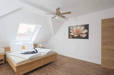 Ein Bett oder Betten in einem Zimmer der Unterkunft Ferienquartier Forsthaus 2