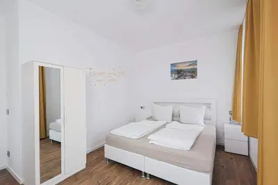 Ein Bett oder Betten in einem Zimmer der Unterkunft Ferienquartier Forsthaus 2