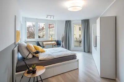 Ein Bett oder Betten in einem Zimmer der Unterkunft Wohnperle Friedrich2 zentrumsnah