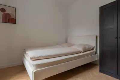 Ein Bett oder Betten in einem Zimmer der Unterkunft Moderne City Appartments