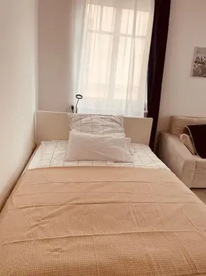 Ein Bett oder Betten in einem Zimmer der Unterkunft Studio-Apartment mit Balkon