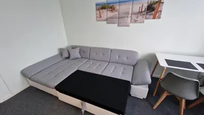 Ein Sitzbereich in der Unterkunft CityCenter Apartment - BigTV-PS4-Netflix-Parking