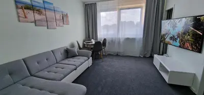 Ein Sitzbereich in der Unterkunft CityCenter Apartment - BigTV-PS4-Netflix-Parking