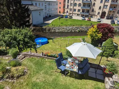 Ein Garten an der Unterkunft HW1B - Urlaubsmagie Gemeinschaftsgarten mit Pool, Sauna & Terrasse