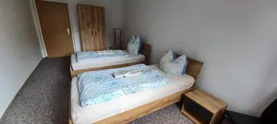 Ein Bett oder Betten in einem Zimmer der Unterkunft Ferienwohnung am Rittergut