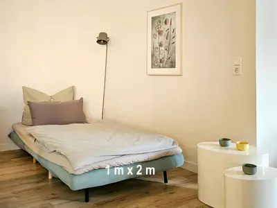 Ein Bett oder Betten in einem Zimmer der Unterkunft Dein Zuhause in der Ferne im grünen Kreativhof 