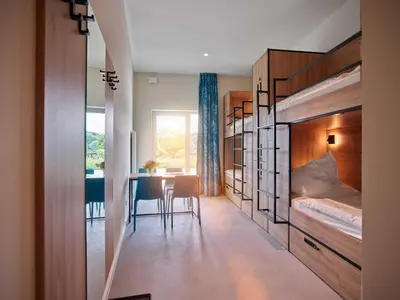 Ein Bett oder Betten in einem Zimmer der Unterkunft Hostel Oschatz