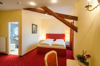 Ein Bett oder Betten in einem Zimmer der Unterkunft Quartier Rautenstock GbR