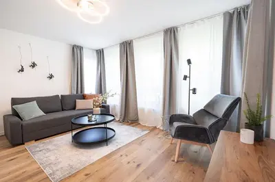 Ein Sitzbereich in der Unterkunft Neues 2 Schlafzimmer Apartment mit RooftopTerrace
