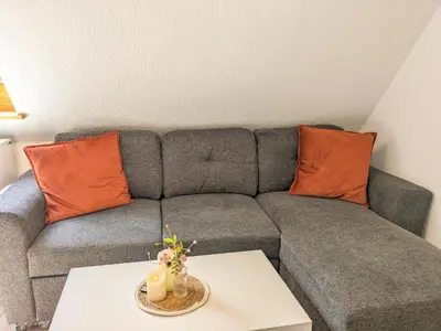 Ein Sitzbereich in der Unterkunft B6 - Urlaubsmagie - Inmitten der Sächsischen Schweiz mit Balkon mit Ausblick auf die Sandsteine