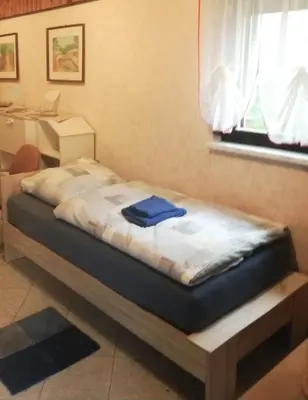 Ein Bett oder Betten in einem Zimmer der Unterkunft Haus am Berg