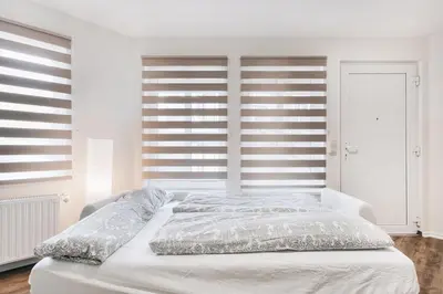 Ein Bett oder Betten in einem Zimmer der Unterkunft Gentilly Apartments Freiberg