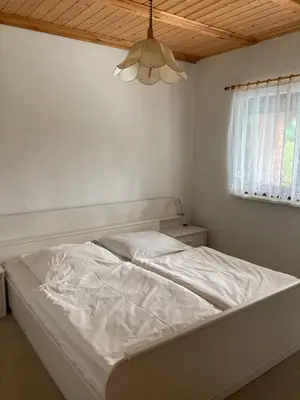 Ein Bett oder Betten in einem Zimmer der Unterkunft FH Waldidylle Nähe Torgau, Seebad Neumühle