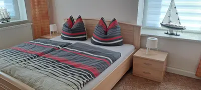 Ein Bett oder Betten in einem Zimmer der Unterkunft Am Forellenteich