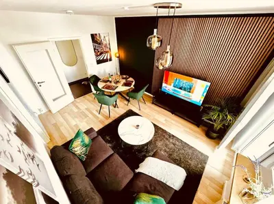 Ein Sitzbereich in der Unterkunft KMHosting Zentrum Luxe Apartment Balkon