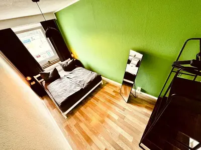 Ein Bett oder Betten in einem Zimmer der Unterkunft KMHosting Zentrum Luxe Apartment Balkon