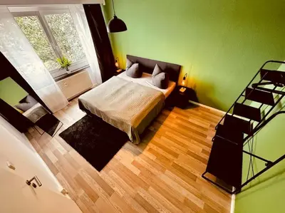Ein Bett oder Betten in einem Zimmer der Unterkunft KMHosting Zentrum Luxe Apartment Balkon