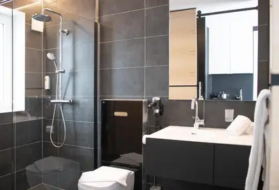 Ein Badezimmer in der Unterkunft FG Hotel by WMM Hotels