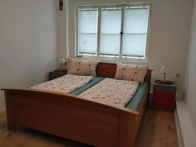 Ein Bett oder Betten in einem Zimmer der Unterkunft Ferienwohnung Kühnel