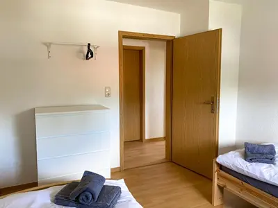 Ein Bett oder Betten in einem Zimmer der Unterkunft Monteurwohnungen Wiednitz, Einzelbetten, Küche, Parkplatz