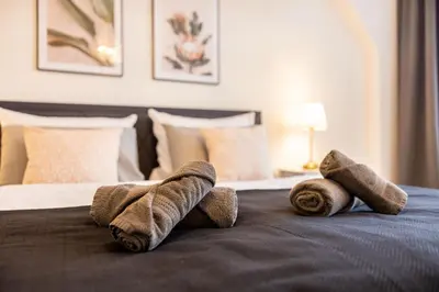 Ein Bett oder Betten in einem Zimmer der Unterkunft Fynbos Apartments in der historischen Altstadt, Loggia, Parkplatz