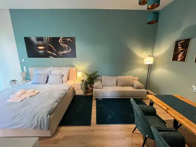 Ein Bett oder Betten in einem Zimmer der Unterkunft Relax Suite am Waldschlösschen Dresden