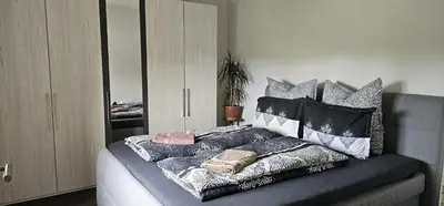 Ein Bett oder Betten in einem Zimmer der Unterkunft SeenSucht & Urlaubsträume, Ferienwohnung 